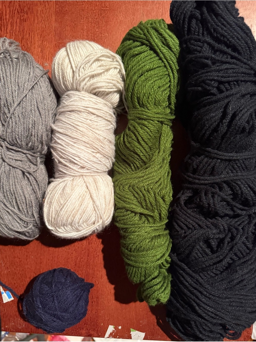 Variety of yarn. Olive, cream, grey, blue, black